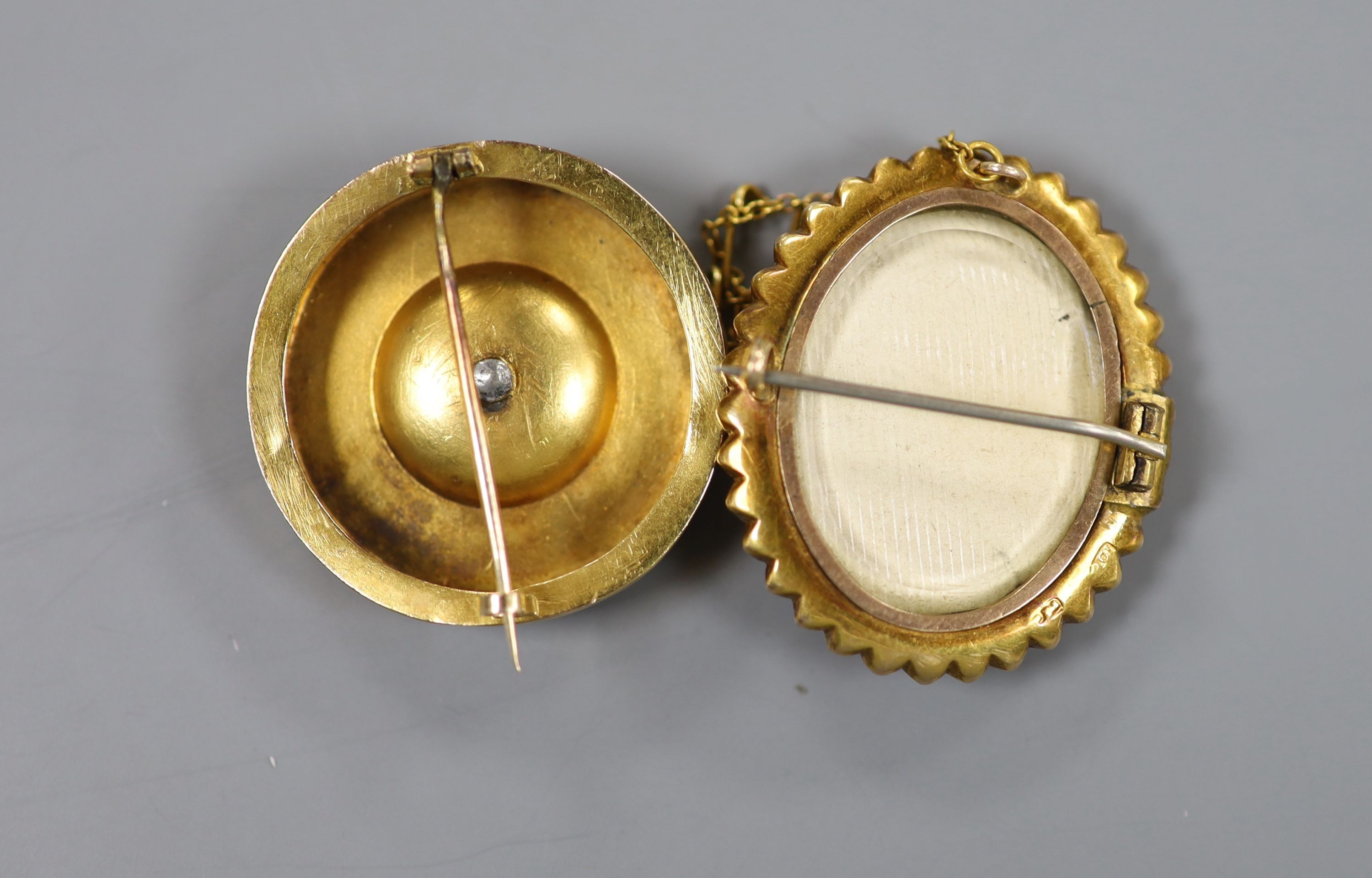 An early 20th century 9ct mounted oval cameo shell brooch, 36mm and an earlier yellow metal and gem set circul17.6 grams.ar brooch, 32mm, gross weight